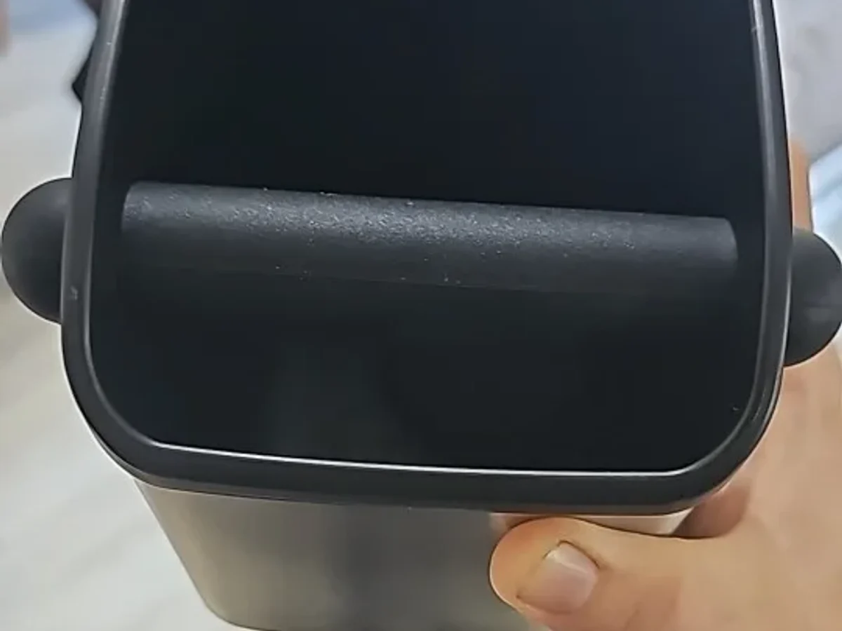 Close view of the Barwright knock box, rubber knock bar spanning the opening between its two supports